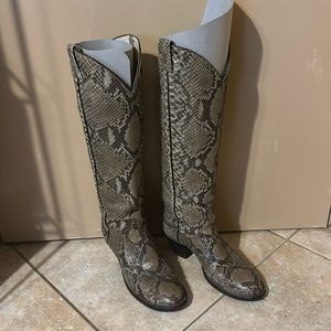 Join the cast of Yellowstone in these sexy soft snakeskin tall cowboy boots.